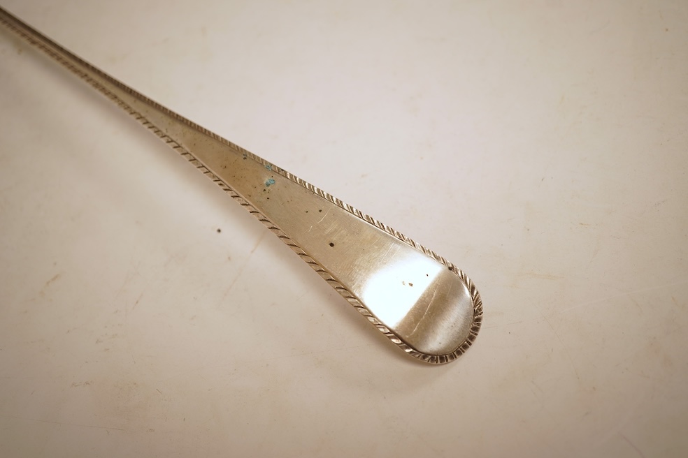 A late George II silver feather edge Old English pattern soup ladle, with fluted bowl, by Richard Rugg, London, 1759, 34cm, 5oz.